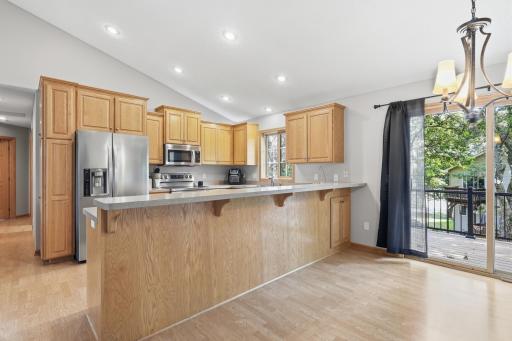 The Dining room is located right off of the kitchen, with a door leading to the updated deck.