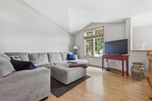 Fresh paint, vaults and large windows letting in tons of natural light in this living area