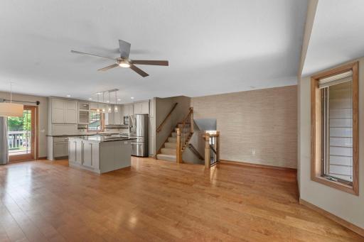 Hardwood floors run throughout the open living spaces, bringing warmth and character while tying everything together.