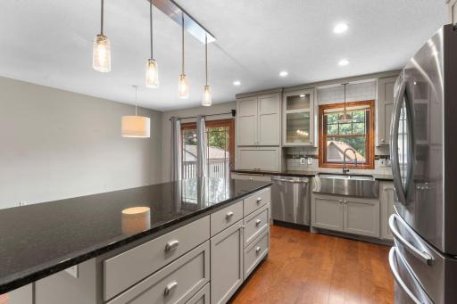 The nearby dining area opens directly to the deck and backyard.