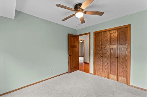 Cozy carpeting and ceiling fans add to the comfort of each room.