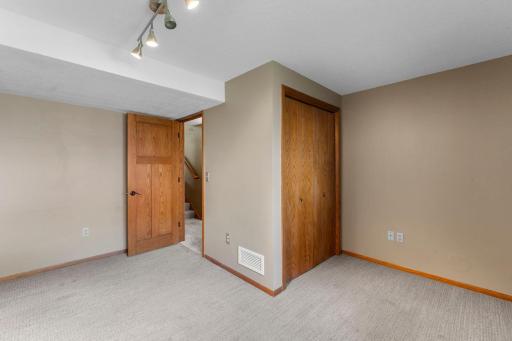 Just nearby, the fourth bedroom offers flexibility for guests, a home office, or a private retreat.