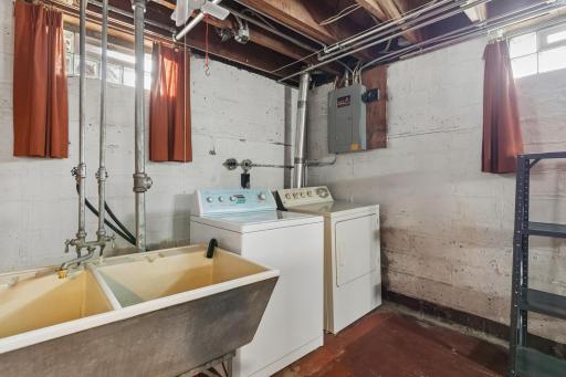 Laundry and sink in basement mechanical room