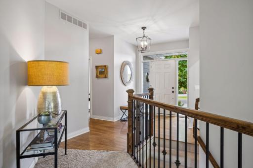 Step inside to a bright, welcoming entry accented by white oak hardwood floors and an open stairway.