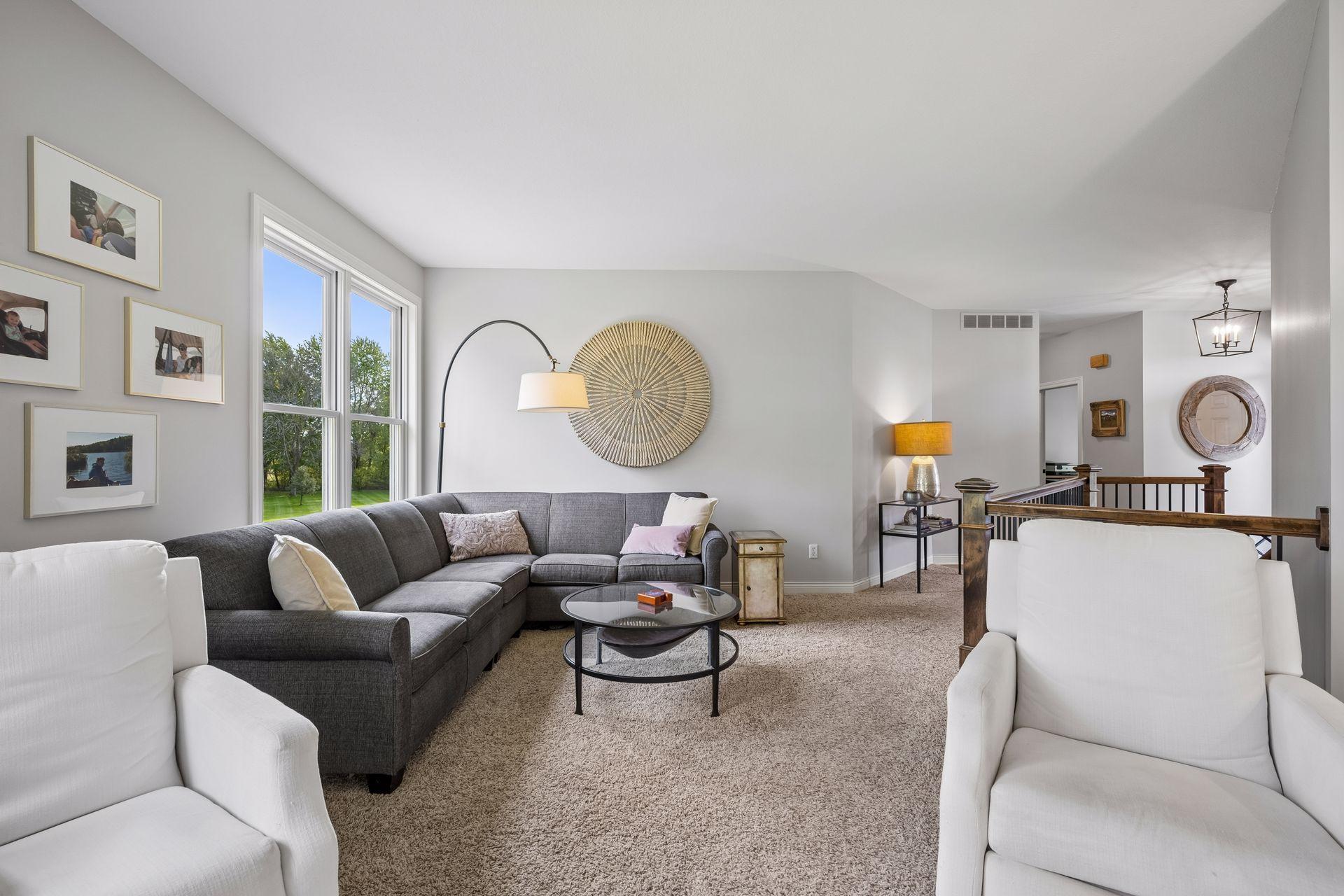 Another view of the living room highlights its comfortable proportions and easy connection to the entry