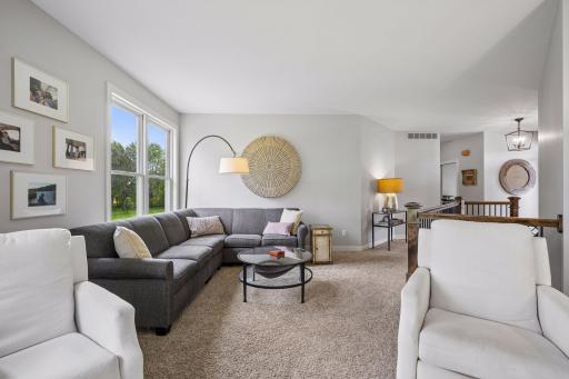 Another view of the living room highlights its comfortable proportions and easy connection to the entry
