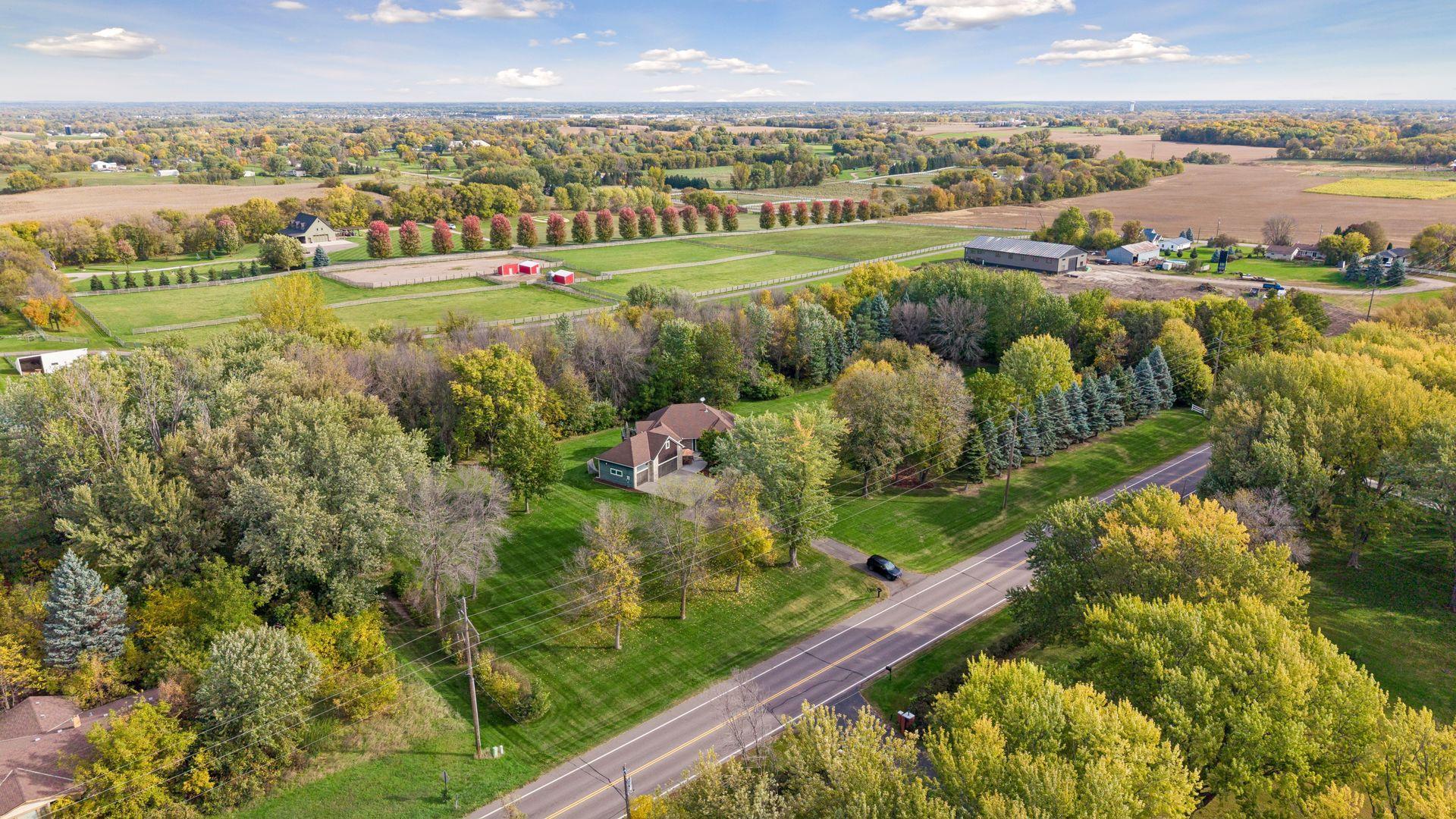 Enjoy a scenic setting surrounded by mature trees and open countryside with plenty of space from neighboring properties.