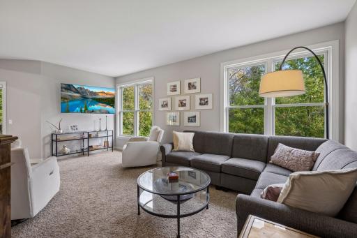 The comfortable living room offers an inviting space to relax and gather with family and friends.