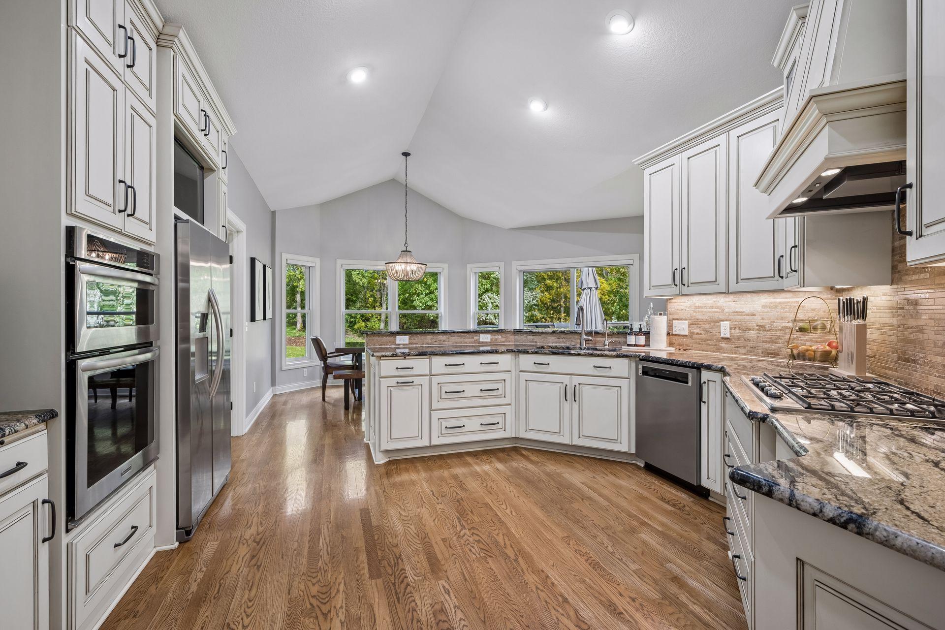 Thoughtfully arranged cabinetry and countertops provide excellent workspace and storage.