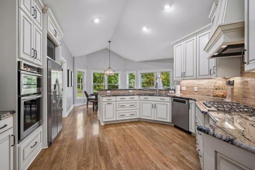 Thoughtfully arranged cabinetry and countertops provide excellent workspace and storage.