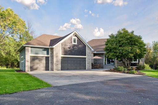 A closer look at the homeâs distinctive design and heated, insulated three-car garage. Tesla super charger, Generac generator, and plenty of storage.