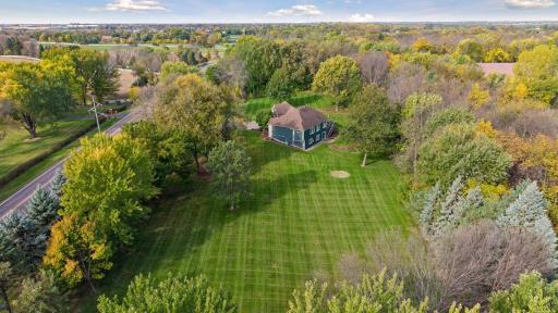 Mature trees frame the property, creating a picturesque backdrop and a wonderful sense of privacy.