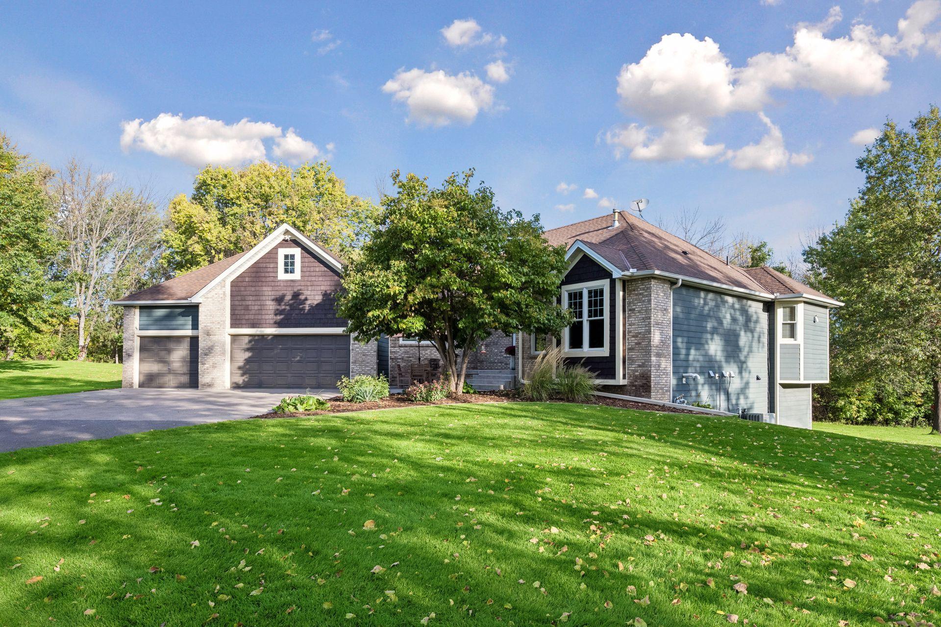 Attractive curb appeal is complemented by established landscaping and a spacious front lawn.