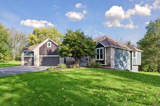 Attractive curb appeal is complemented by established landscaping and a spacious front lawn.