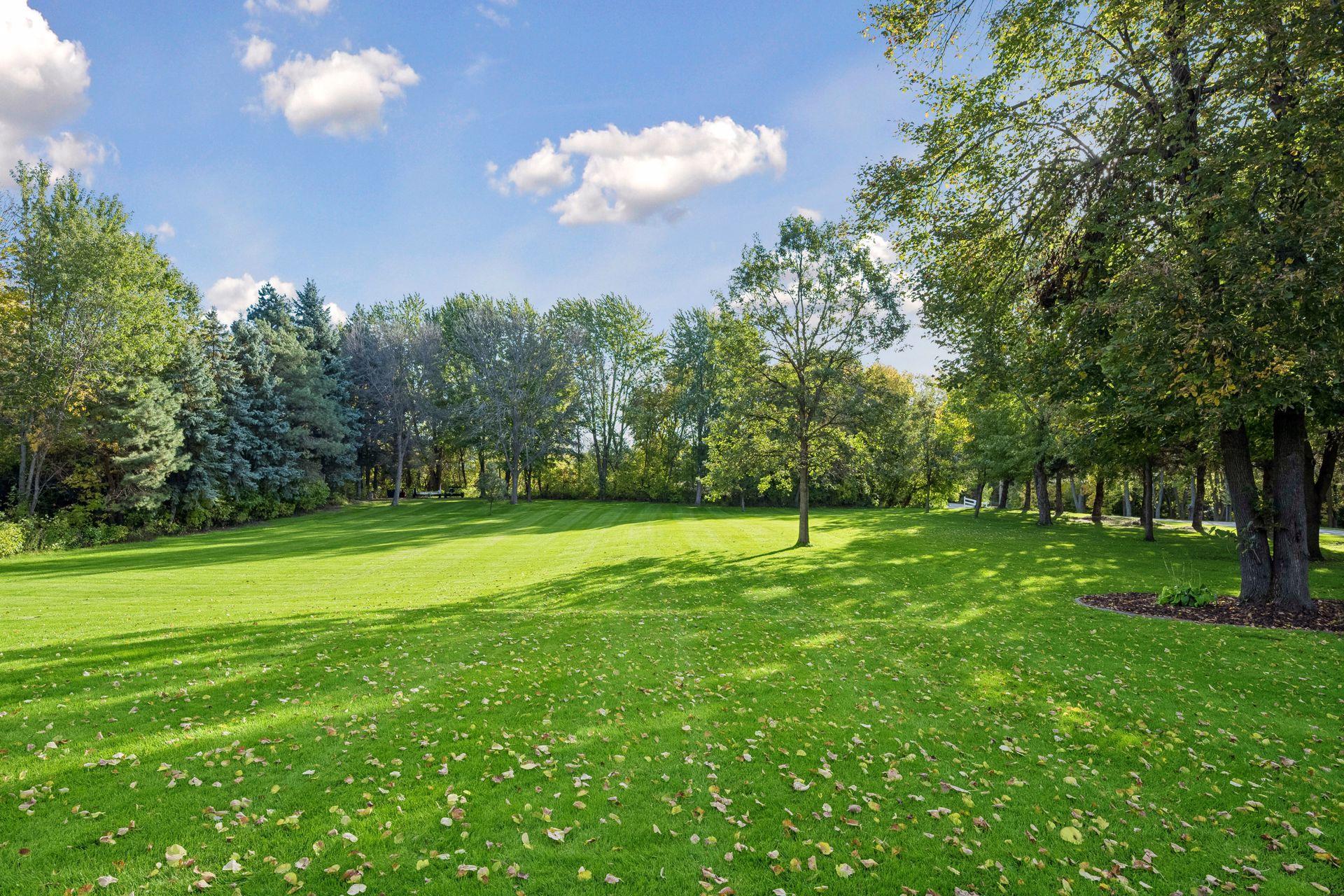 The expansive lawn provides plenty of room to play, entertain, or create gardens tailored to your style. A 20-zone irrigation system keeps everything looking green and beautiful.
