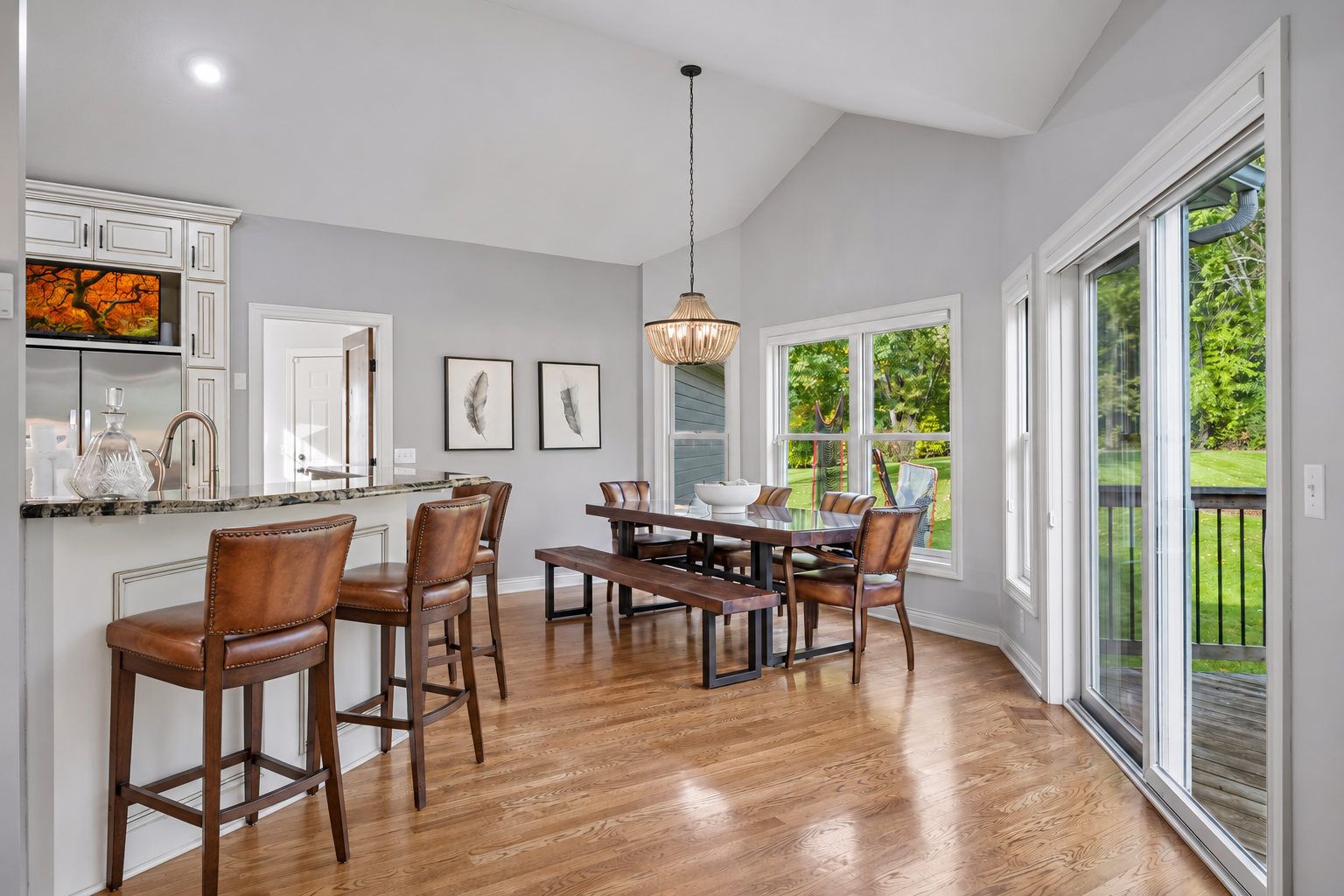 Some virtual barstool additions show plenty of room between the breakfast bar and the dining table.