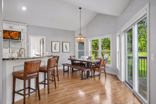 Some virtual barstool additions show plenty of room between the breakfast bar and the dining table.