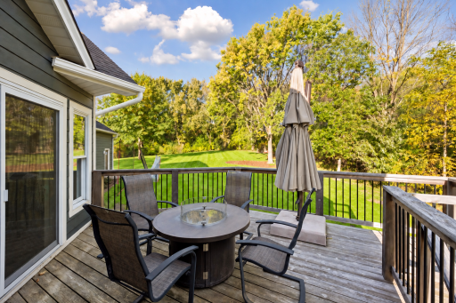 Relax or dine outdoors on the deck while overlooking the peaceful, tree-lined acreage.