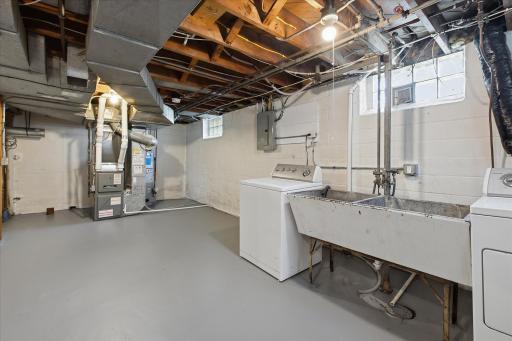 he spacious basement provides excellent utility and storage space, with laundry facilities, mechanical equipment, and ample room for organization.