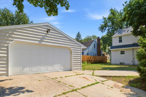 The oversized detached garage provides ample room for vehicles, equipment, and storage.