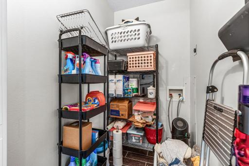 Large walk-in closet and washer and dryer hookup offers built-in shelving and abundant storage for clothing and personal items.