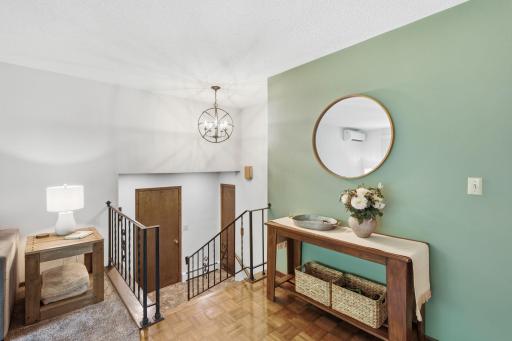 Welcoming entry featuring the new light fixture and convenient access to the main living areas.