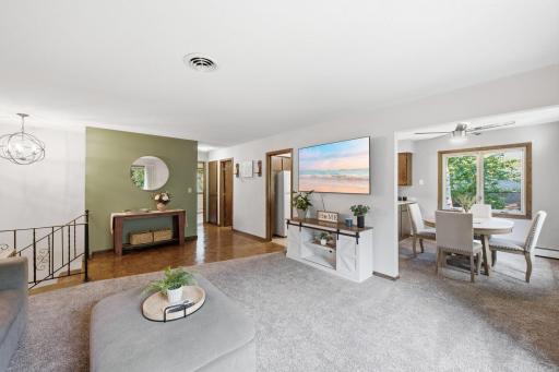 Open connection between the living and dining areas creates a functional layout for everyday living and entertaining.