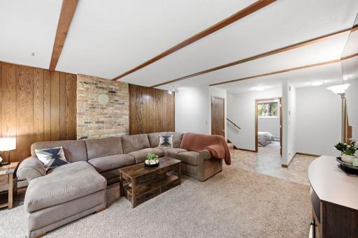 Additional view of the generous lower-level living space, offering flexibility for relaxing, entertaining or recreation.
