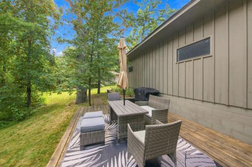 Spacious rear deck offers plenty of room for outdoor dining, grilling and entertaining.