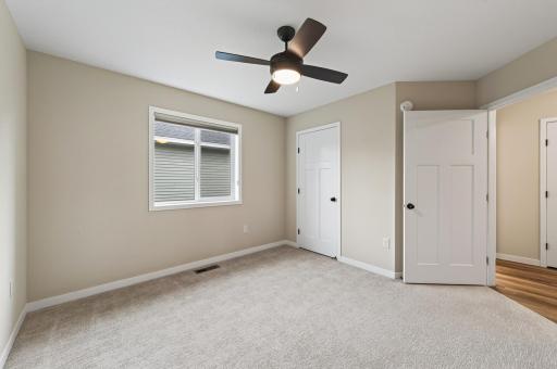 13' x 12' comfortable second bedroom with ceiling fan.