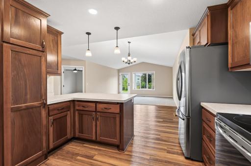 Large peninsula opens to the combined dining and living areas.