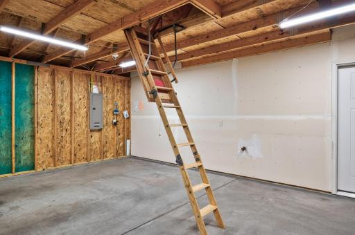 Upgraded pull-down attic ladder proveds easy access to additional storage.