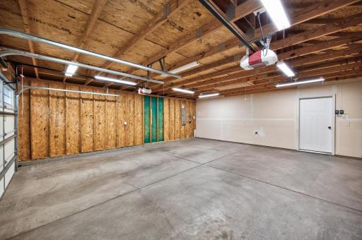 Oversized 25.4' x 23.4' two-car garage with extra storage space.