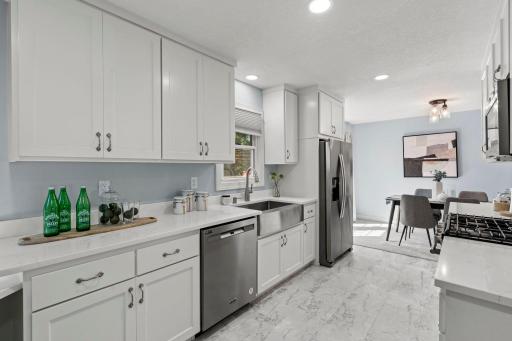 Another perspective of the kitchen, featuring an open layout that flows seamlessly into the dining room.
