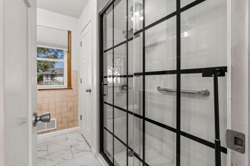 Another look at the sleek and stylish 3/4 bathroom.