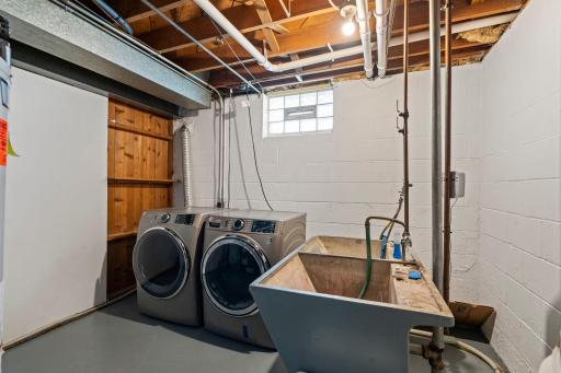 An unfinished laundry room and storage room provide plenty of space for organization, hobbies, and all your storage needs.