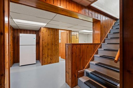 The finished lower level offers a spacious recreation area, versatile flex room, and convenient 3/4 bathroom.