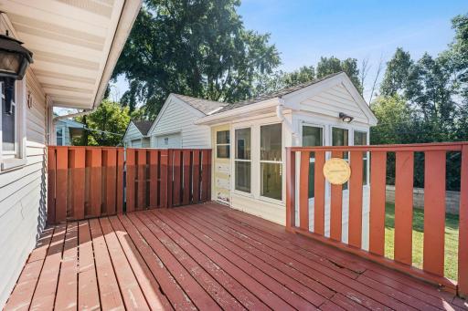 Just off the deck, a three-season screened porch connects to the 1½-stall detached garage, adding even more functional living and entertaining space.