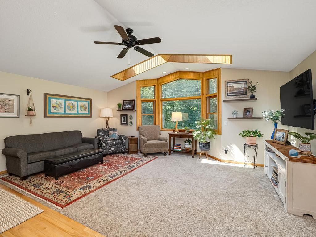 Living Room with Huge Bay Window Overlooking Wooded Backyard- Main Level