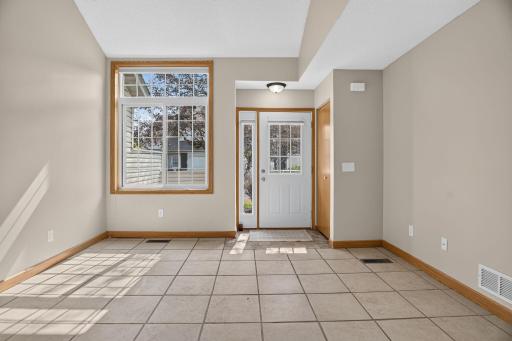 Ready for you to walk through my front door! My durable tile floors are practical and ready to handle real life.