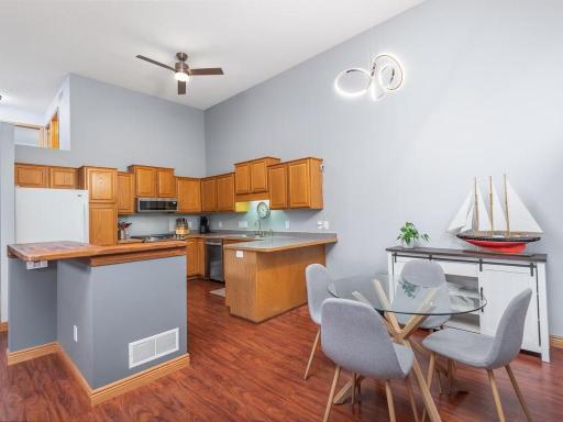 Dining and kitchen area with breakfast bar and center island.