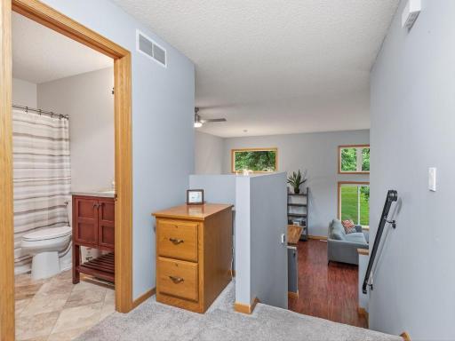 Upper level landing at the stairs area. This area opens to 2 bedrooms and bathroom. There is also a storage closet for linens and extras here.