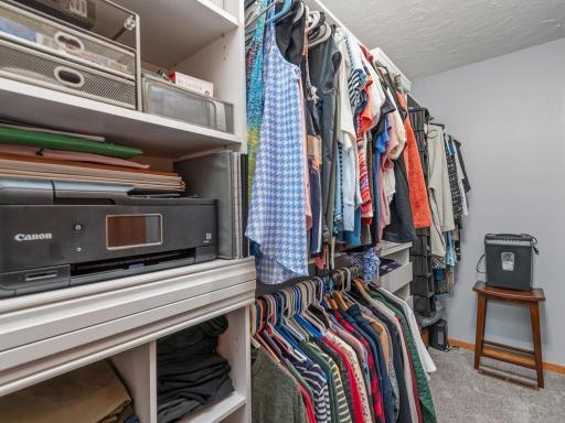 Walkin closet in the owners bedroom area. Built in's convey with the sale they are attached.
