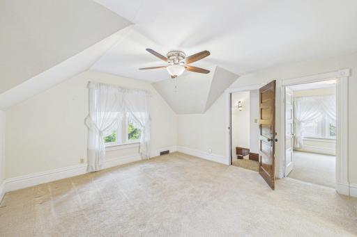 Large upper level main room. It could be used as a bedroom, a family room, a gaming room - you decide! And note the front stairs in the photo.This second stairway is VERY steep and there are no handrails. Please do not use those steps during showings