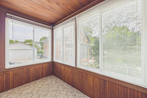Smaller room off the main level kitchen. Updated windows. No heat. This could be a nice sitting space or combined storage space!