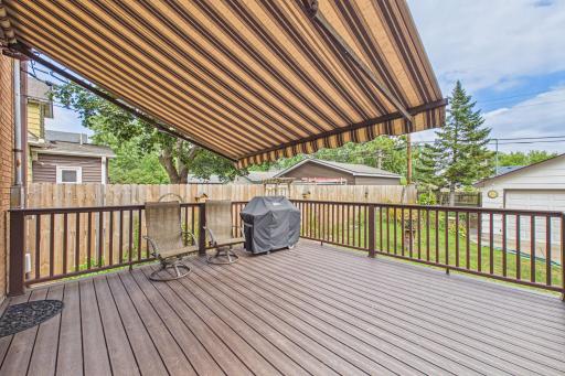 This is a composite deck!! Long lasting and LOW maintenance! A LOVELY outdoor space for enjoying evenings in nature in your own back yard. AND the added benefit of the retractable large awning for protection from rain and sun!