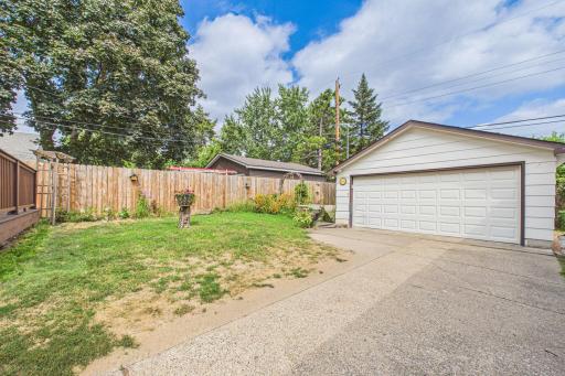 Fully fenced back yard and two car garage.