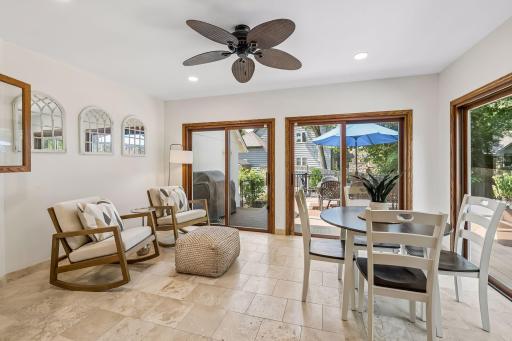 With sliding door windows on two sides offering direct access to the deck, the four-season porch is an easy favorite for morning coffee, casual meals or simply enjoying the backyard in every season.