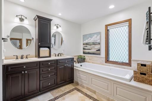 Start the morning with plenty of room to spread out at the dual vanity, or slow things down in the soaking tub.