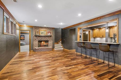 This is the kind of room that makes staying in sound like the best plan with plenty of space to gather, hardwood floors underfoot and a fireplace that sets the mood for relaxed evenings and a full bar for easy entertaining.